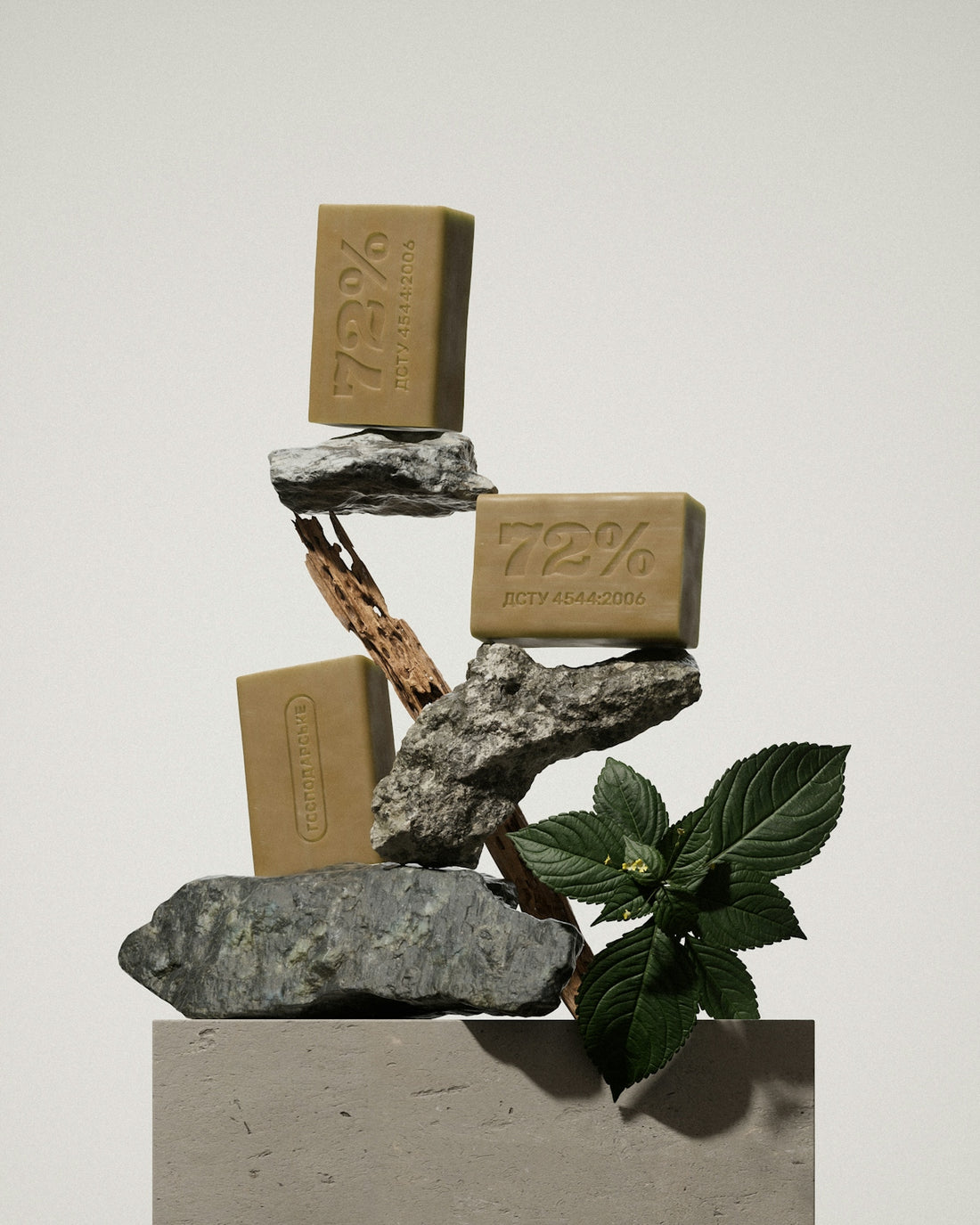 A sculpture of rocks and a plant with a bar of soap on top of it